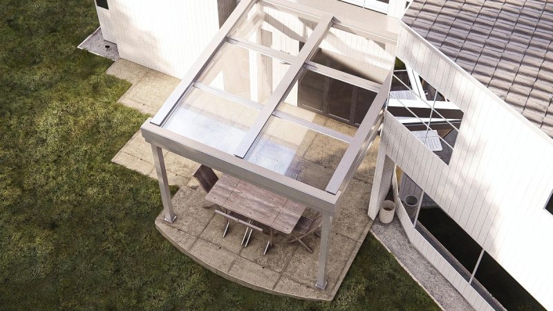 Pergomatic glassroom with slim taupe frame and clear roof caps serene courtyard of planters and white privacy wall.