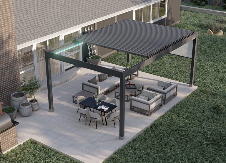 Pergomatic louvered pergola with charcoal aluminum frame shelters patio lounge and dining set; LED strip glows at corner.